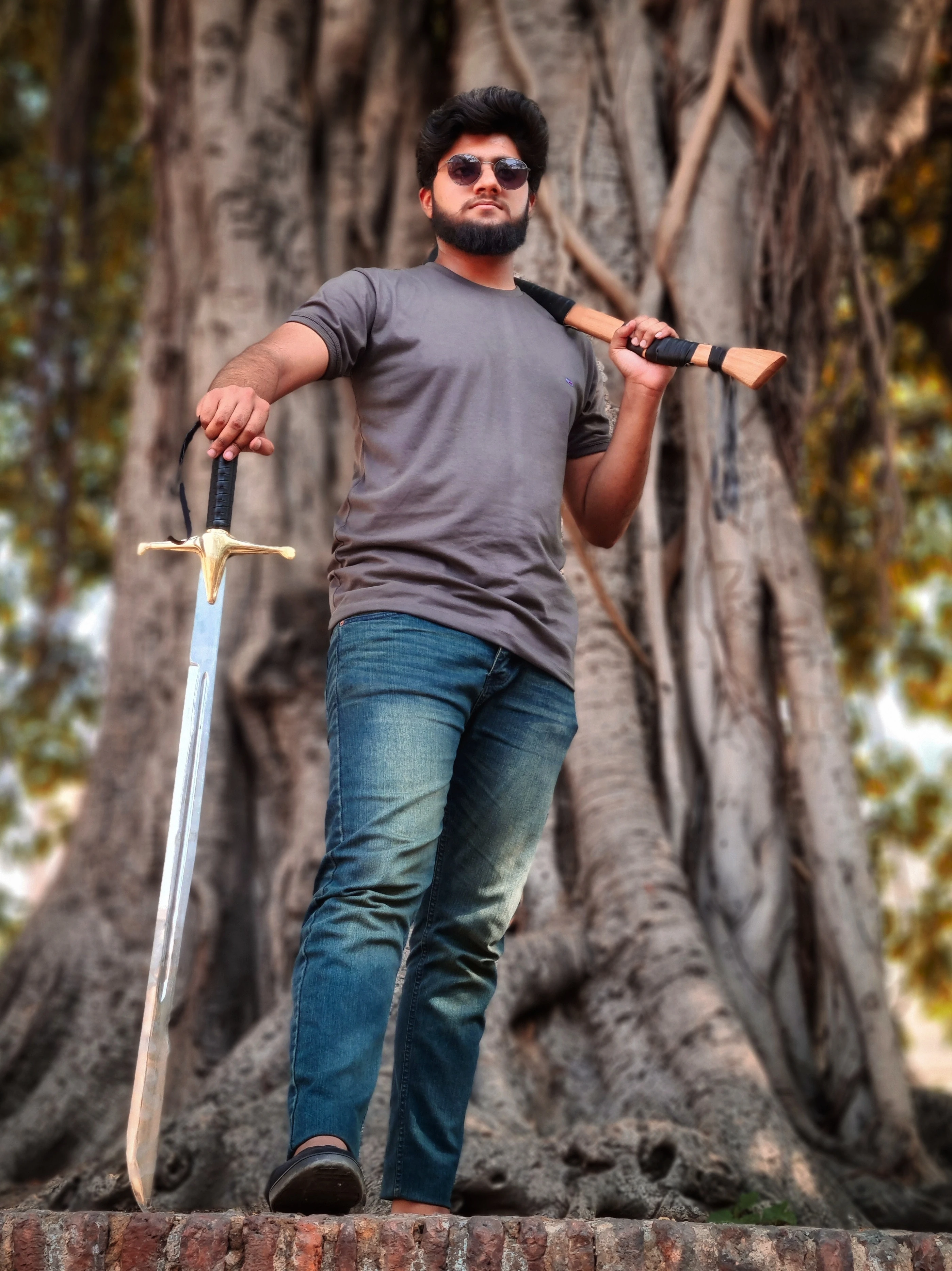 ProDeSquare posing before a tree with an axe in hand